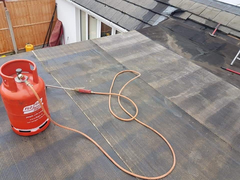 flat roof repair dublin using bitumen flashing and heat