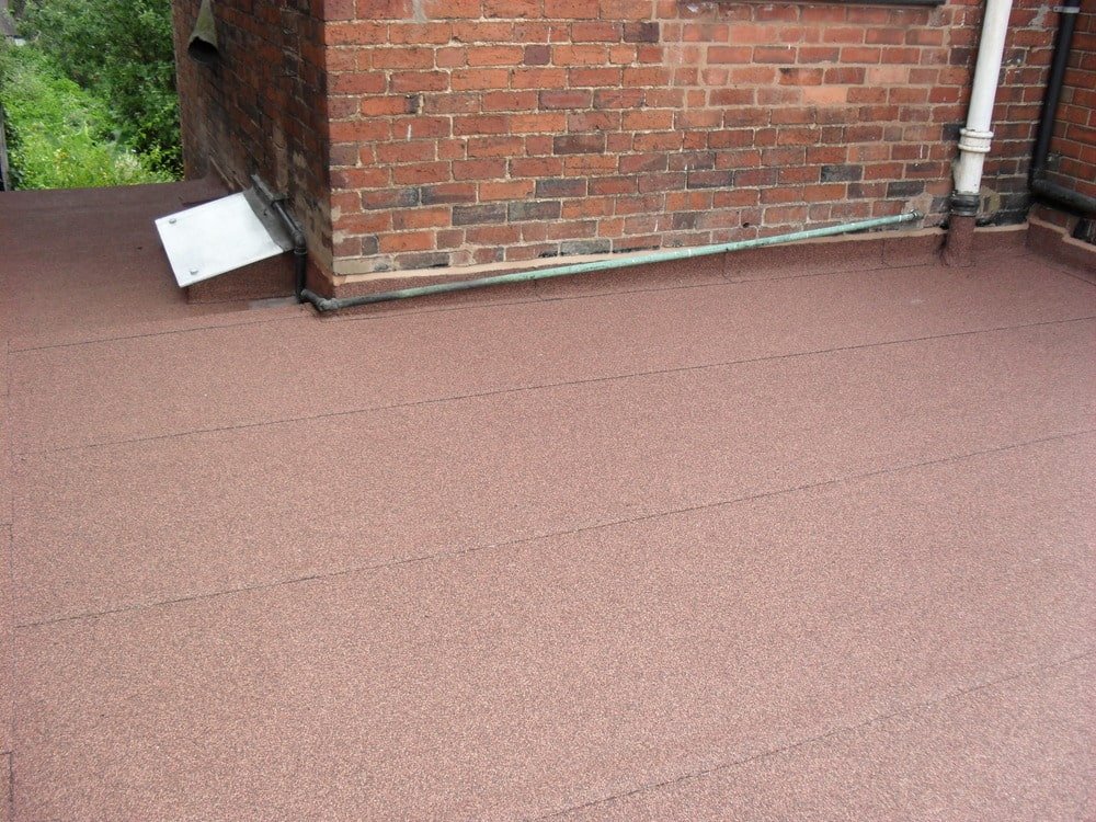 red asphalt roof flashing on a cottage