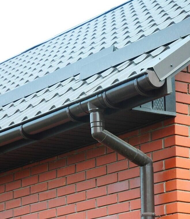 black gutter freshly installed after repair