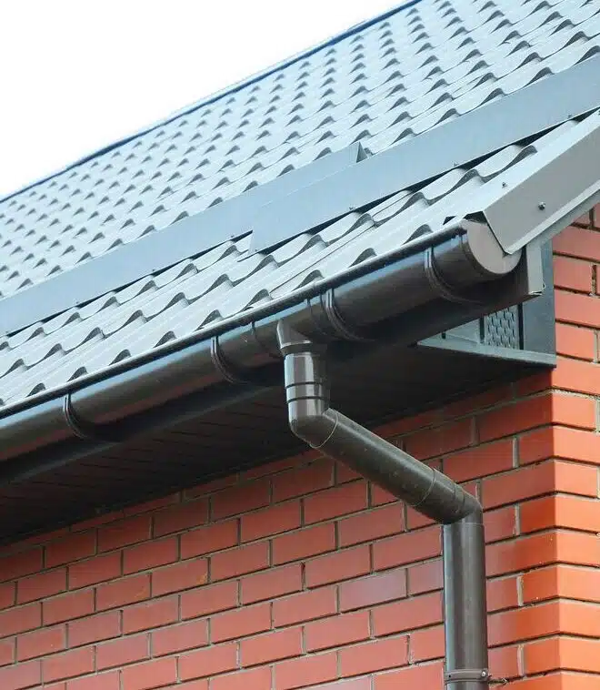 black gutter freshly installed after repair