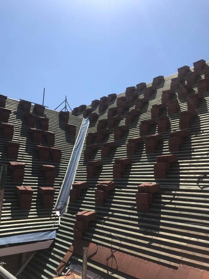 brand new roof being installed by professional roofers