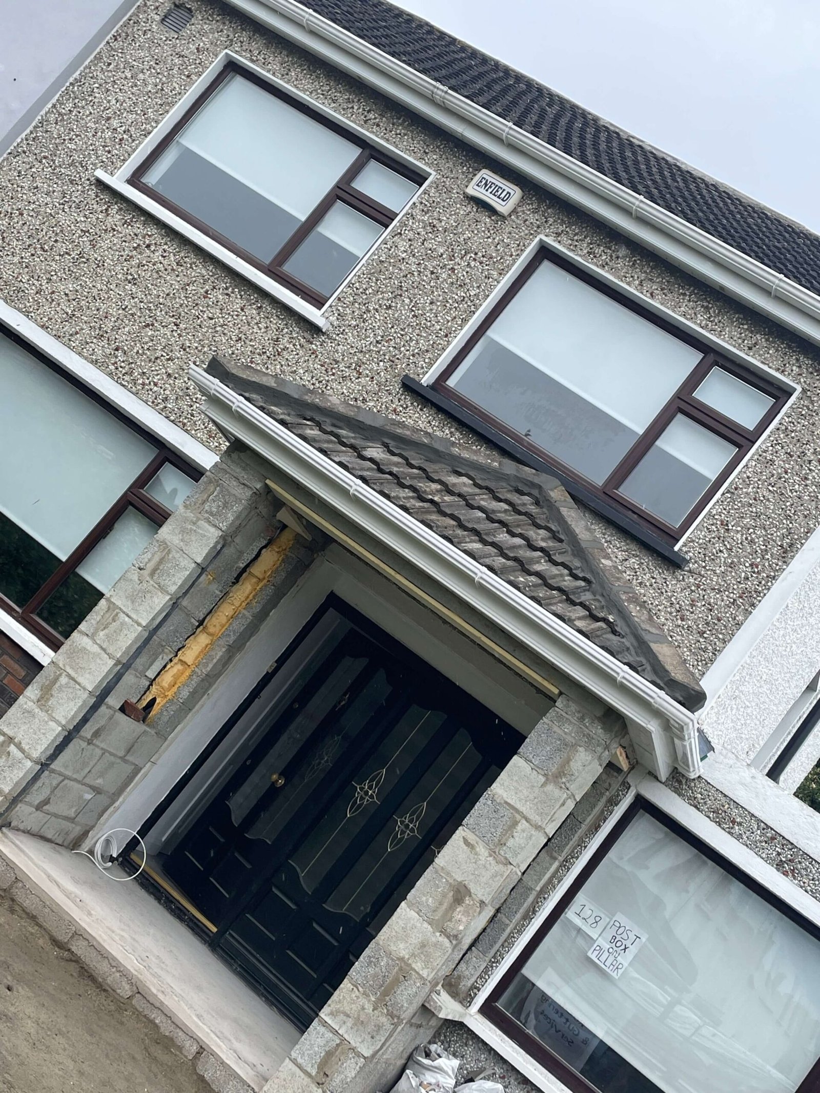1990s house roof being repaired